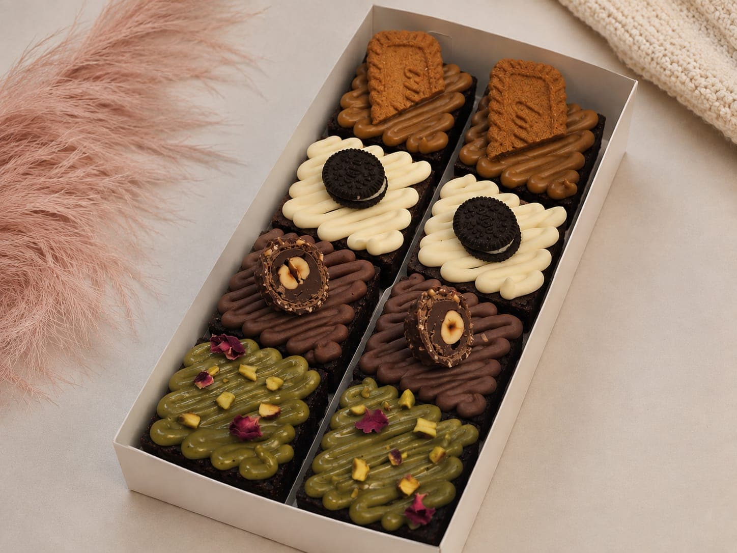 Assorted gourmet brownies with Biscoff, Oreo, hazelnut, and pistachio toppings